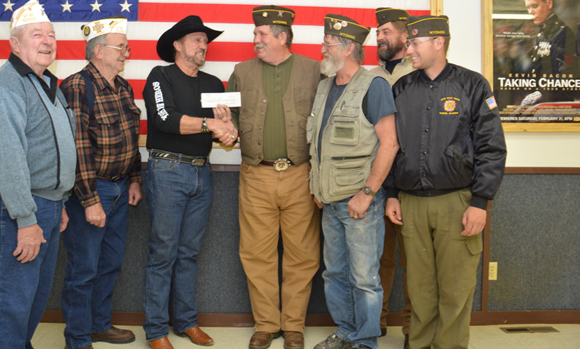 Bone Daddy Knives awarded a check to vfw
